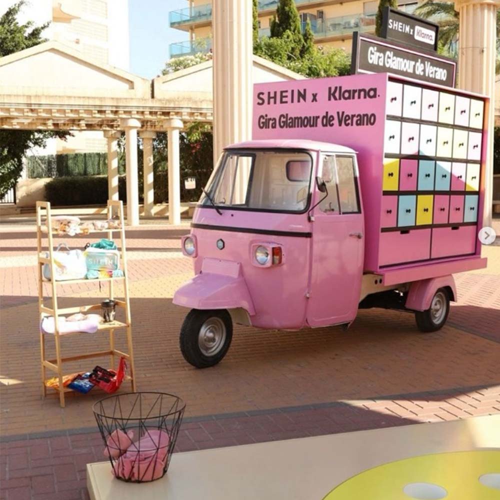 Photograph of the built pink Piaggio vehicle and modular drawer cabinet at the activation